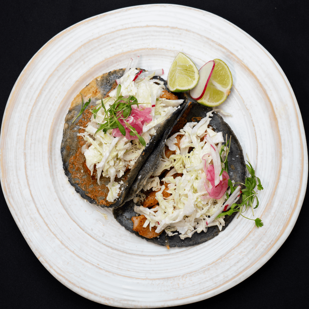 High Marea fish tacos with crema slaw and lime-pickled onions