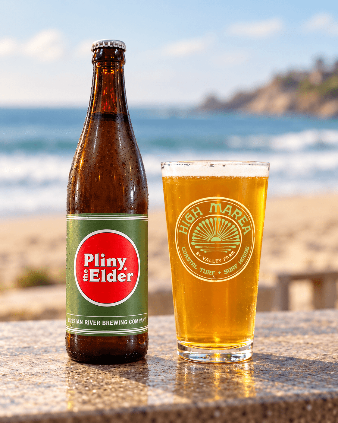 Pliny the Elder bottle beside a High Marea glass of beer overlooking the coast